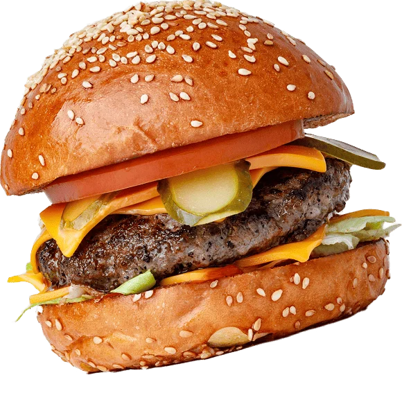 Cheeseburger with sesame seed bun, beef patty, cheese, lettuce, tomato, and pickles