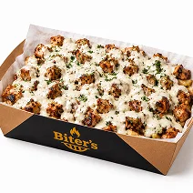 Loaded fries topped with shawarma and creamy sauce